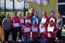 Members of Cylch Meithrin Seiont a Pheblig with (L-R) Delyth Murphy, Prof Jerry Hunter and Elen Davies