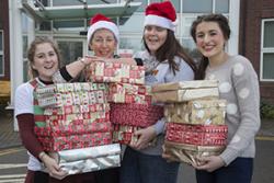 : Student nurses at Wrexham Maelor hospital delivering Christmas gifts to patients on the Bedwen and Onnen long stay rehab wards. Pictured are Fern Williams,  Lecturer Angela Williams, Ceri Davies and Kate Topple.