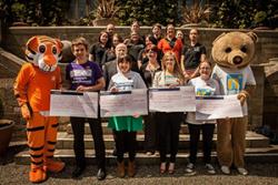 Representatives from some of the charities who benefited from funds raised through the year by Bangor University RAG receive their cheques.