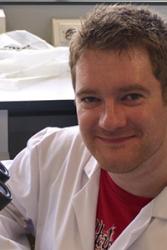 Adam Hargreaves at work in the lab at the School of Biological Sciences.