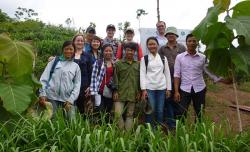 The team visiting an on-farm agroforestry demonstration plot of teak, coffee, plum, and strips of fodder grass, in Mai Son District, Northwest Vietnam.