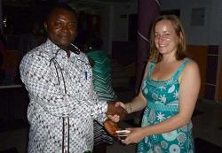 Genevieve presenting gifts from Bangor University to Daniel Ofori, director of the Forestry Research Institute of Ghana (FORIG). FORIG hosted the distance learning MSc Tropical Forestry Summer School in Kumasi, Ghana. July 2015.