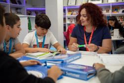 Ms Aliyeva with pupils