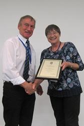 Professor Hilary Downes (Birkbeck College, University of London & President of the Society) presents Prof Johnson with a commemorative certificate.