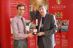 Ben Butler (left) being presented with the Drapers' Medal by John Giffard, Master Draper.