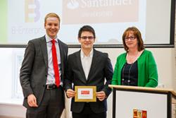 Bogdan Pop (centre) receiving his Santander Universities Excellence in Enterprise Award from Luke Ellis, Relationship Director at Santander Universities, and Lowri Owen, Enterprise Projects Manager