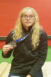 Catrin with a silver medal for Wales from the Commonwealth Weightlifting Championships in Australia last year.