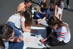 Year 8 pupils at Ysgol Dyffryn Ogwen, Bethesda create a poster outlining what they see as the economic, social, environmental and cultural benefits of community energy.