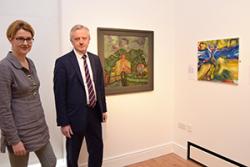 Professor Carol Tully, who is leading the research shows Vice-Chancellor, Professor John G Hughes around the EuroVisions Exhibition at Bangor’s Storiel.