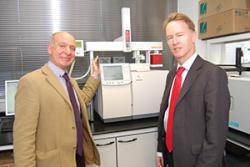 Prof Chris Freeman shows Dr Emyr Roberts specialist equipment used to measure the gases from wetlands.