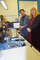 Professor Tang explains the high-tech equipment at his lab to the Minister.