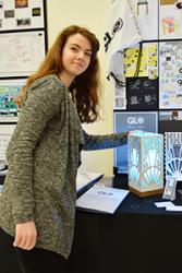 Carys Matthews of Ysgol y Creuddyn makes last minute adjustments to her work at the Exhibition