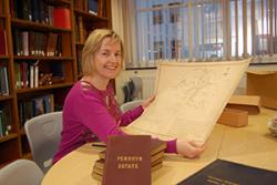 Archivist Elen Simpson with some of the papers from the Penrhyn Estate collection.