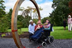 Dr Sophie Williams with Shaun Russell (Director) and Natalie Chivers (Curator) of the Treborth Botanic Garden, Bangor University, after cutting the ribbon at the Moongate entrance to the new Chinese Garden. 