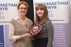 While all the Peer Guides at Bangor University were thanked, Victoria Fennel was awarded Peer Guide of the Year. here she is presented with a shield by Vice Chancellor Prof Carol Tully.