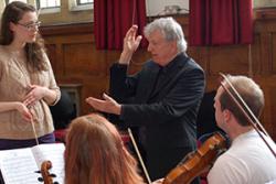 Catherine Linney receiving advice and feedback from Conductor, Owain Arwel Hughes.