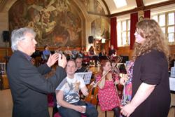 Francesca Reader listens to valuable feedback on her conducting from Owain Arwel Hughes.