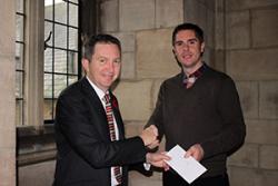 Professor Oliver Turnbull (left) presenting David with the £1,000 cheque.