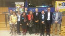 Delyth Prys (4th from left) and Dewi Bryn Jones (right) at the European Parliament with Jill Evans MEP (centre)