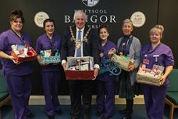 Adult nursing students with Cllr John Pritchard and lecturer Angela Wiliams.: Photo: Craig Colville