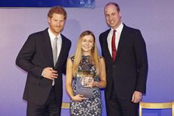 Elan Gilford with TRH Prince Harry and the Duke of Cambridge.