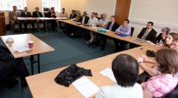 Students and staff listen intently to Professor Ala Hamoudi