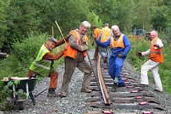 Ffestiniog Railway volunteers enjoying their volunteering experience.