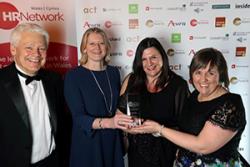 Left- right: Geraint Wilson-Price, Director of Teaching, Cymraeg Gwent presented the Award to: Nia Meacher, Deputy Director HR; Tracy Hibbert, Director of HR and Mari Ellis-Roberts, HR Officer, Bangor University.