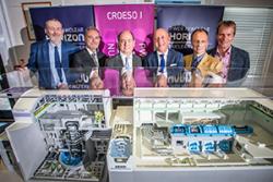 Dr Ian Rees, Grŵp Llandrillo Menai; Francisco Sánchez, Tecnatom; Francisco Javier Guerra, CEO,Tecnatom; Duncan Hawthorne, CE Horizon; Professor Paul Spencer, Greg Evans, Horizon,: behind a scale model of the Advanced Boiling Water Reactor (ABWR)