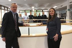 Professor John G Hughes welcomes Natalie Burgess of Microsoft to the University, with some of the staff taking part in the training session.