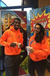 Campus Life Crew members John and Mariya sample some Fair Trade Hot chocolate.