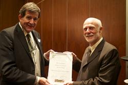  Prof John Witcombe (right) receiving the Award.