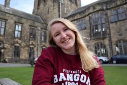 Kathryn in front of the University's main building.