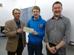 Curtis Edwards with Professor Paul Spencer and Dr Iestyn Pierce receiving his MEng bursary cheque