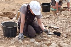  A volunteer on an archaeological dig.