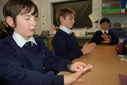 Some of the pupils of ysgol Pen y Bryn, Colwyn Bay practicing Paws B- the version of mindfulness meditation adpated for the classroom are: : left-right: Caeo Adey-Davies, Bryn Hayton and Ali Al- Ranni.