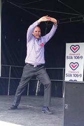 Ned leads a yoga demonstration at a recent event.