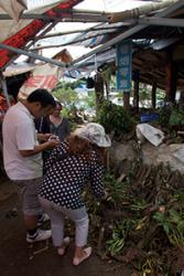 Dr Sophie Williams (rear), who initiated the research, visiting an orchid market in China.