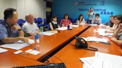 Peter Huxley, second from left, presents his research findings to representatives from Hong Kong NGOs