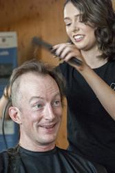 Ronan Roche of the School of Ocean Sciences mid head-shave.