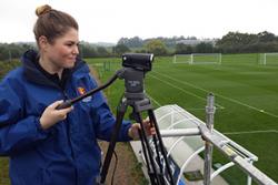 Student volunteer Abbey Forshaw filming at the sports analysis training session.