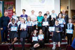 Winners and finalists displaying their trophies with Councillor John Wyn Williams, Mayor of Bangor, and Hywel Williams, MP for Arfon (left).