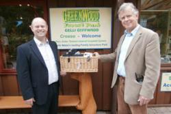 Green Innovation Network Project Manager, Stuart Bond (left), presents Stephen Bristow, Managing Director of Greenwood Forest Park with the Welsh produce hamper. 