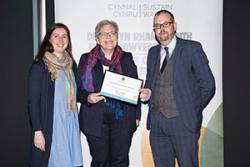 Dr Einir Young and Dr Gwenith Elias accepting the Sustain Award on behalf of Bangor University at the Senedd in Cardiff.