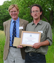 Tim Peters (right) receiving the 2014 Bangor Bursary from Sir Jack Whitaker (left), President of the Royal Forestry Society (photograph courtesy of Les Starling)