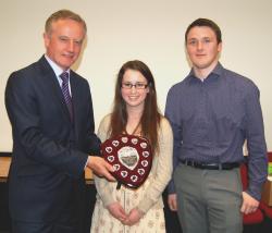 The Vice Chancellor presenting Victoria and Joe with the Peer Guide of the Year shield.