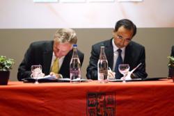 Professor John G Hughes (left) and Professor HUANG Jin signing the agreement.