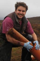 Dr Christian Dunn collecting samples on a bog.