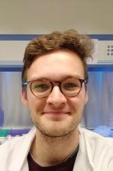 An image of PhD student Will Perry in the labs at Bangor University.