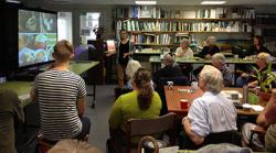 Yang Xi gives a presentation to a packed audience at Treborth Botanic Garden 